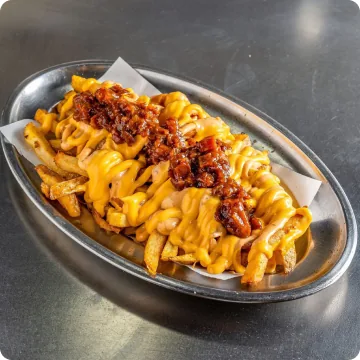 Monster Fries: patatas con cheddar fundido y bacon crujiente